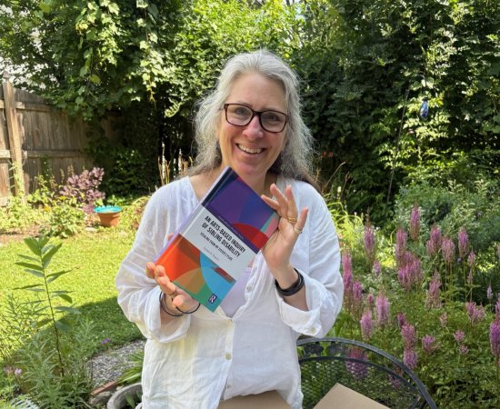 Linnea Franits with her book - An Arts-Based Inquiry of Sibling Disability: Stealing from My Sister’s Plate