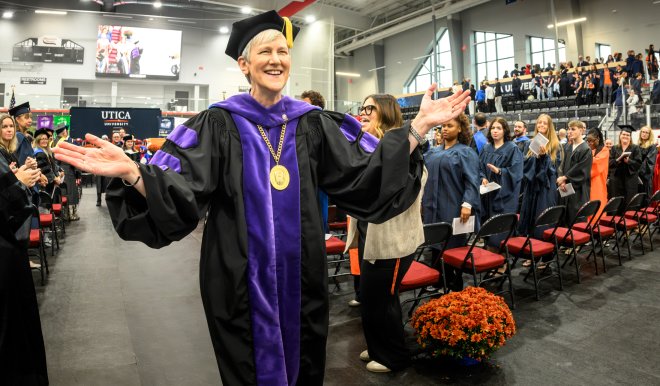 President Stephanie Nesbitt exits past the crowd at her presidential inauguration.